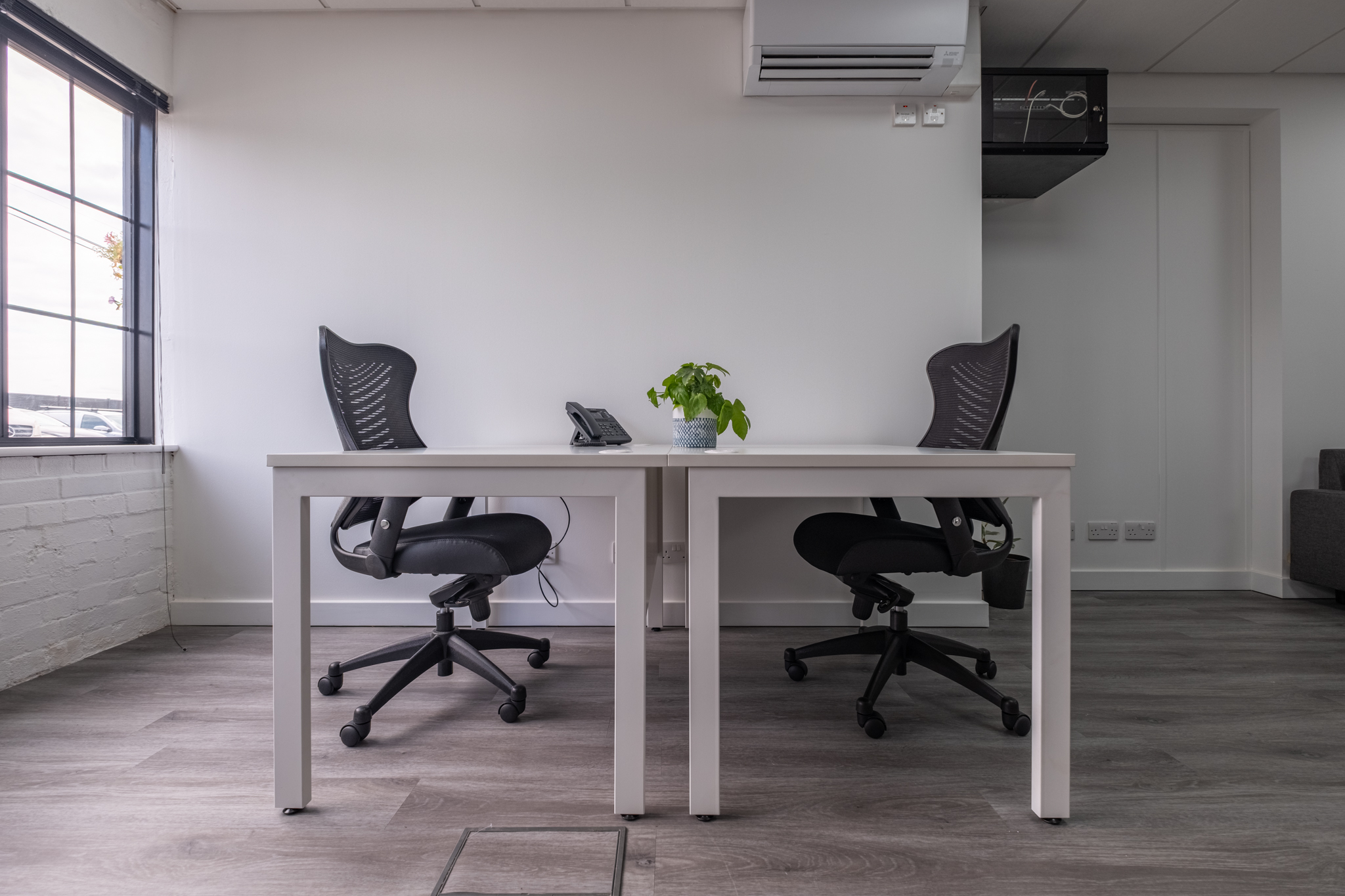 Office 3, Ground Floor, 4 Tannery House - 230FT² 8 Minimalist office with two chairs.