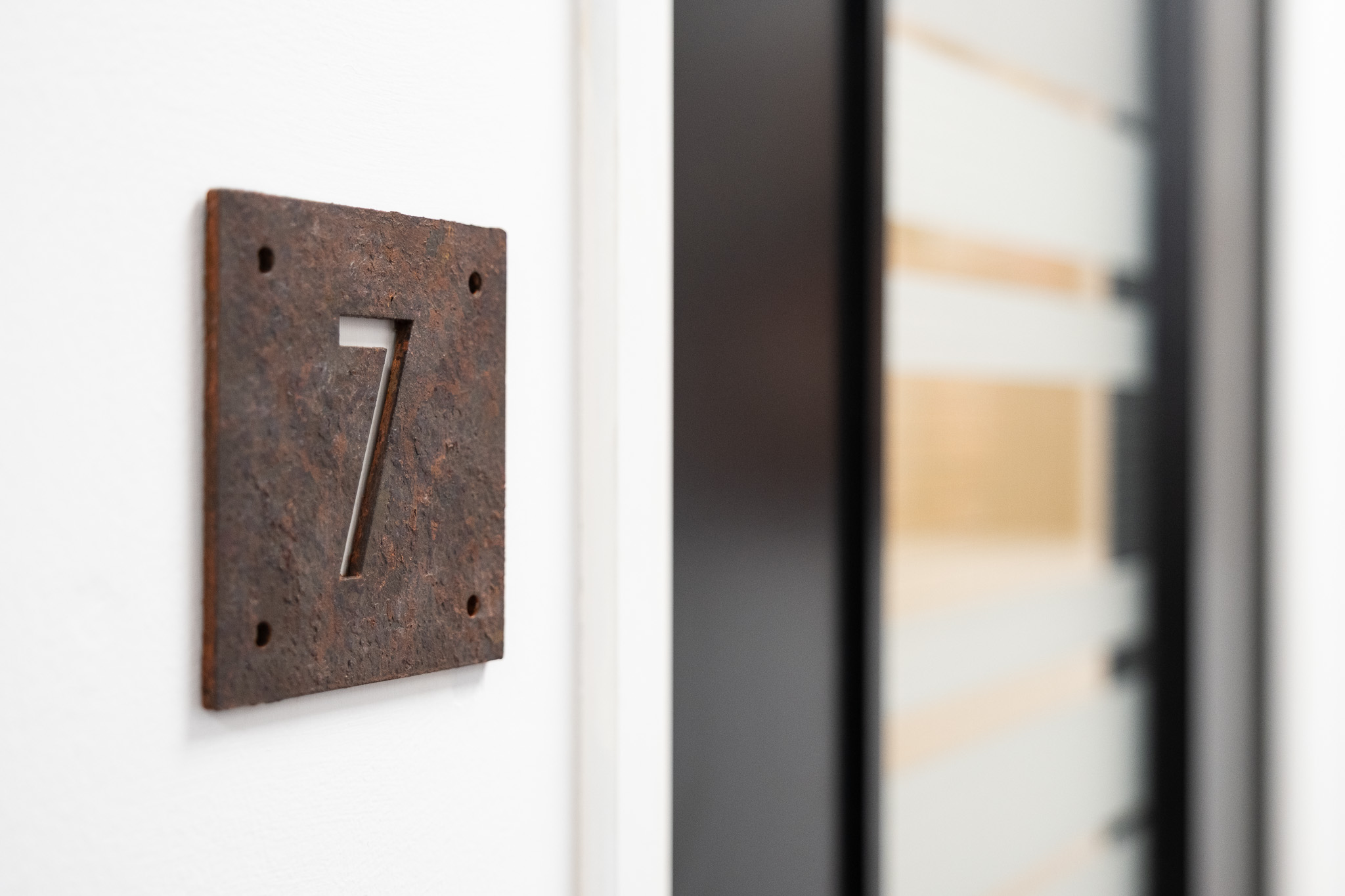 Office 7, Ground Floor, 4 Tannery House -218FT² 7 Close up on door sign number for office 7, 4 Tannery House with corridor in background